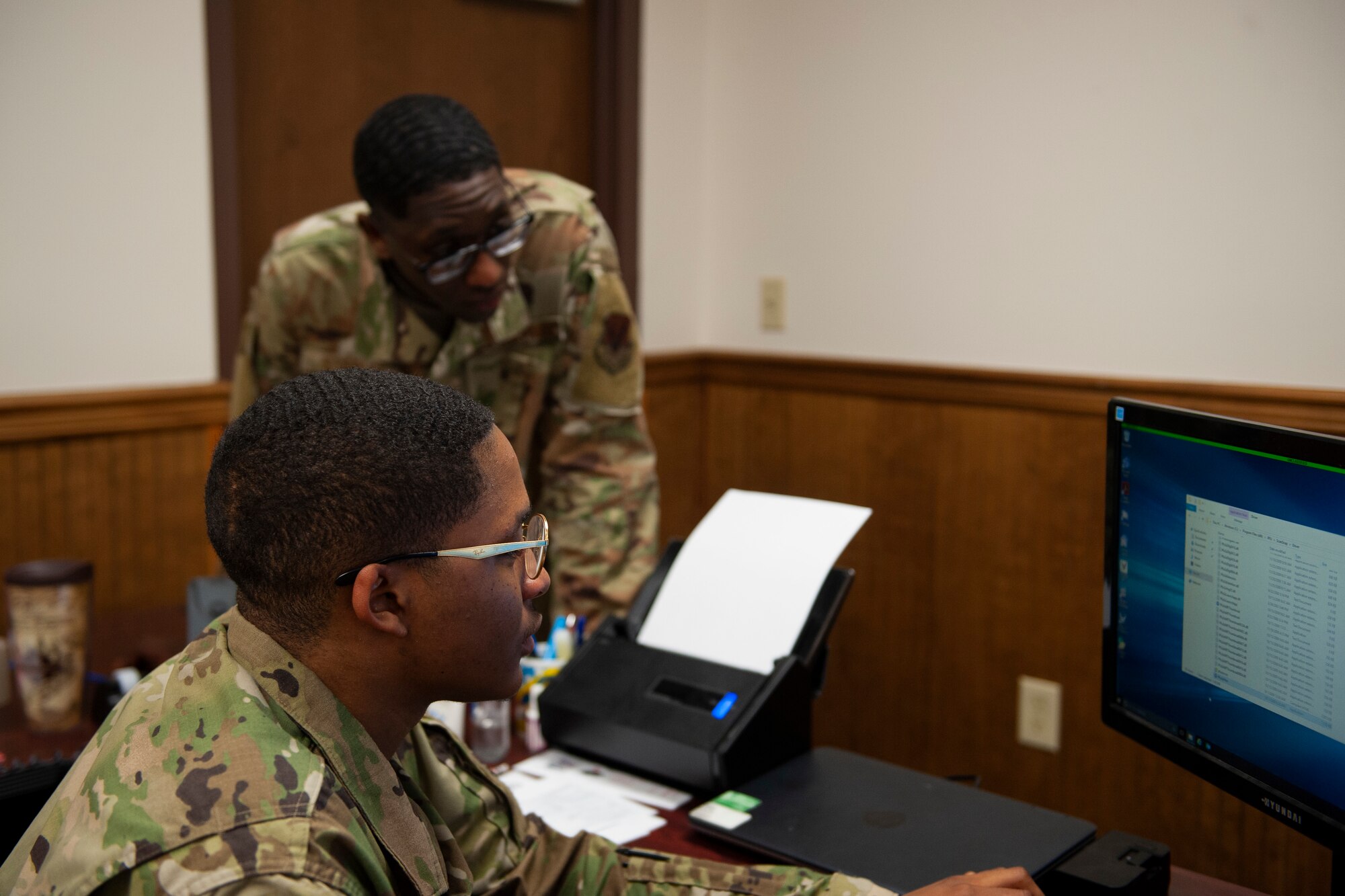 Photo of Airman installing software