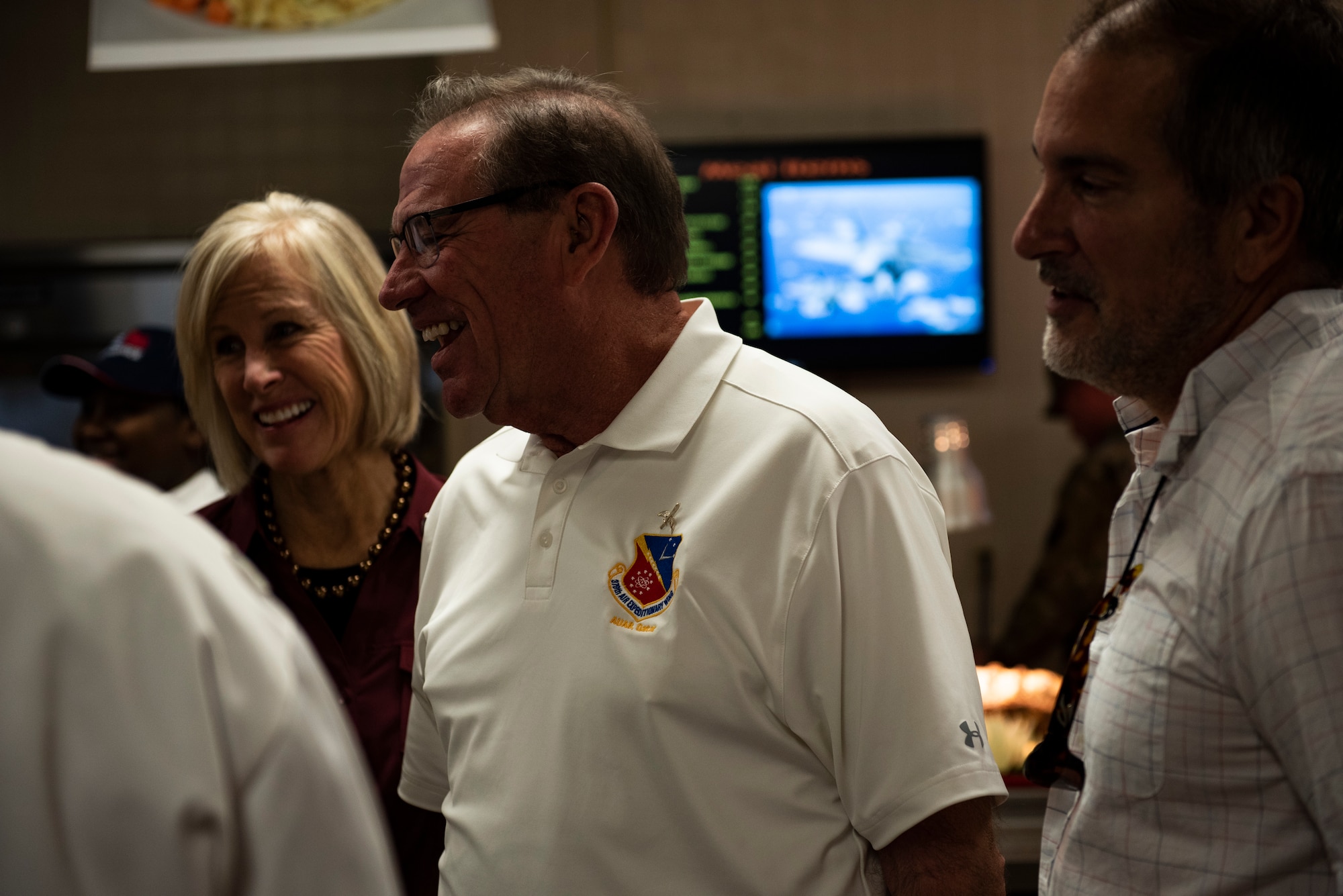 Leah Dunn, left, Florida Congressman Neal Dunn, center, and Dr. Daniel Daube, right, attend the 325th Force Support Squadron's holiday meal celebration at Tyndall Air Force Base, Florida, Nov. 28, 2019. Meal attendees were served by commanders, chiefs, first sergeants, and special guests of the 325th Fighter Wing, to honor the service and sacrifice of military members past and present. (U.S. Air Force photo by Staff Sgt. Magen M. Reeves)