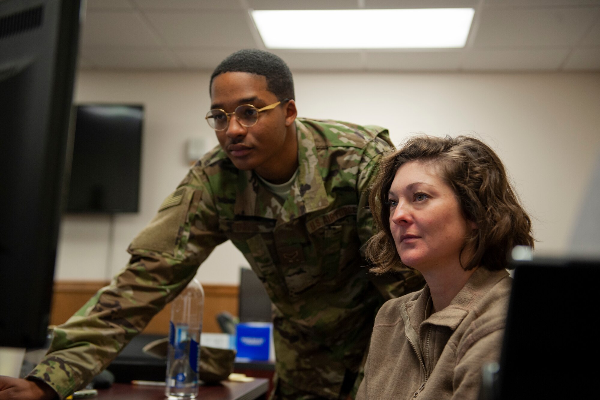 Photo of Airman helping a customer
