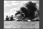 View looking at "Battleship Row" on Dec. 7, 1941, after the Japanese attack. (Official U.S. Navy Photograph, NHHC Collection)