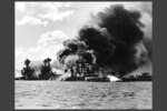 View looking at "Battleship Row" on Dec. 7, 1941, after the Japanese attack. (Official U.S. Navy Photograph, NHHC Collection)