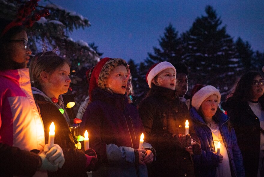 Students from the Hanscom Middle School select choir sing holiday carols during the 2019 base tree lighting ceremony at Hanscom Air Force Base, Mass., Dec. 4. The ceremony also included hot chocolate, cookies, and an ice sculpture display. (U.S. Air Force photo by Lauren Russell)