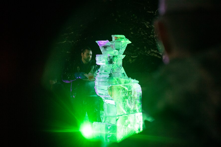 Lars Miller, an ice sculpter, carves a reindeer out of ice during the 2019 base tree lighting ceremony on Hanscom Air Force Base, Mass., Dec. 4. The ceremony included holiday carols sung by the Hanscom Middle School select choir and hot chocolate. (U.S. Air Force photo by Lauren Russell)