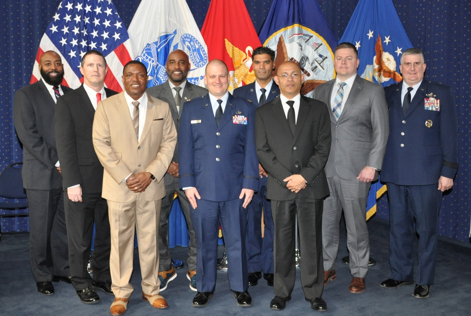 group of civilian and military personnel