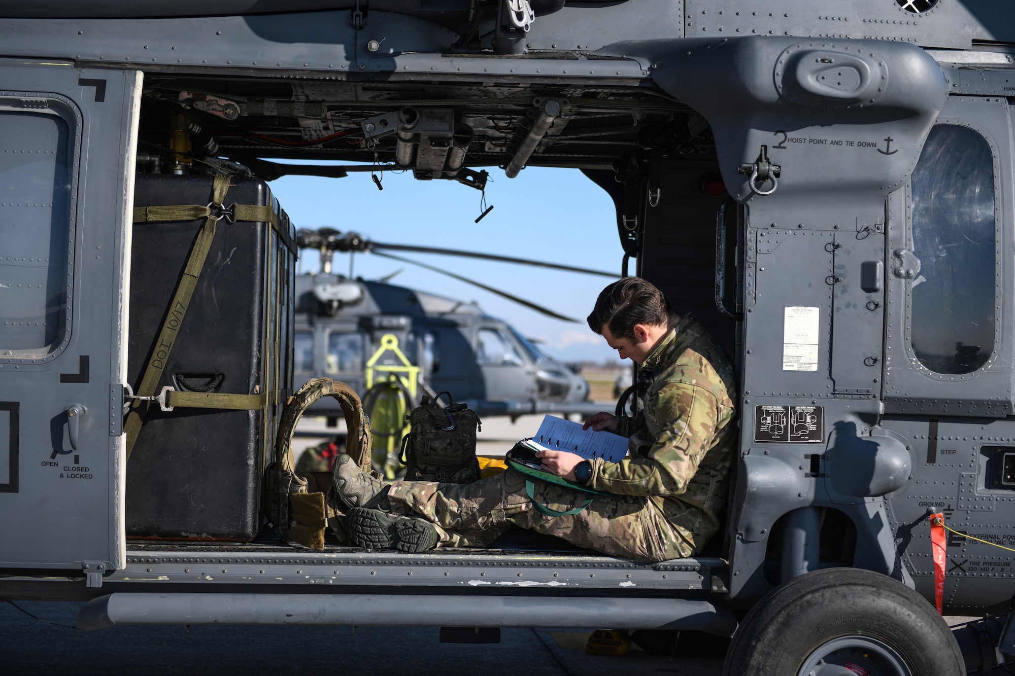 Special mission aviator reviews forms prior to take off