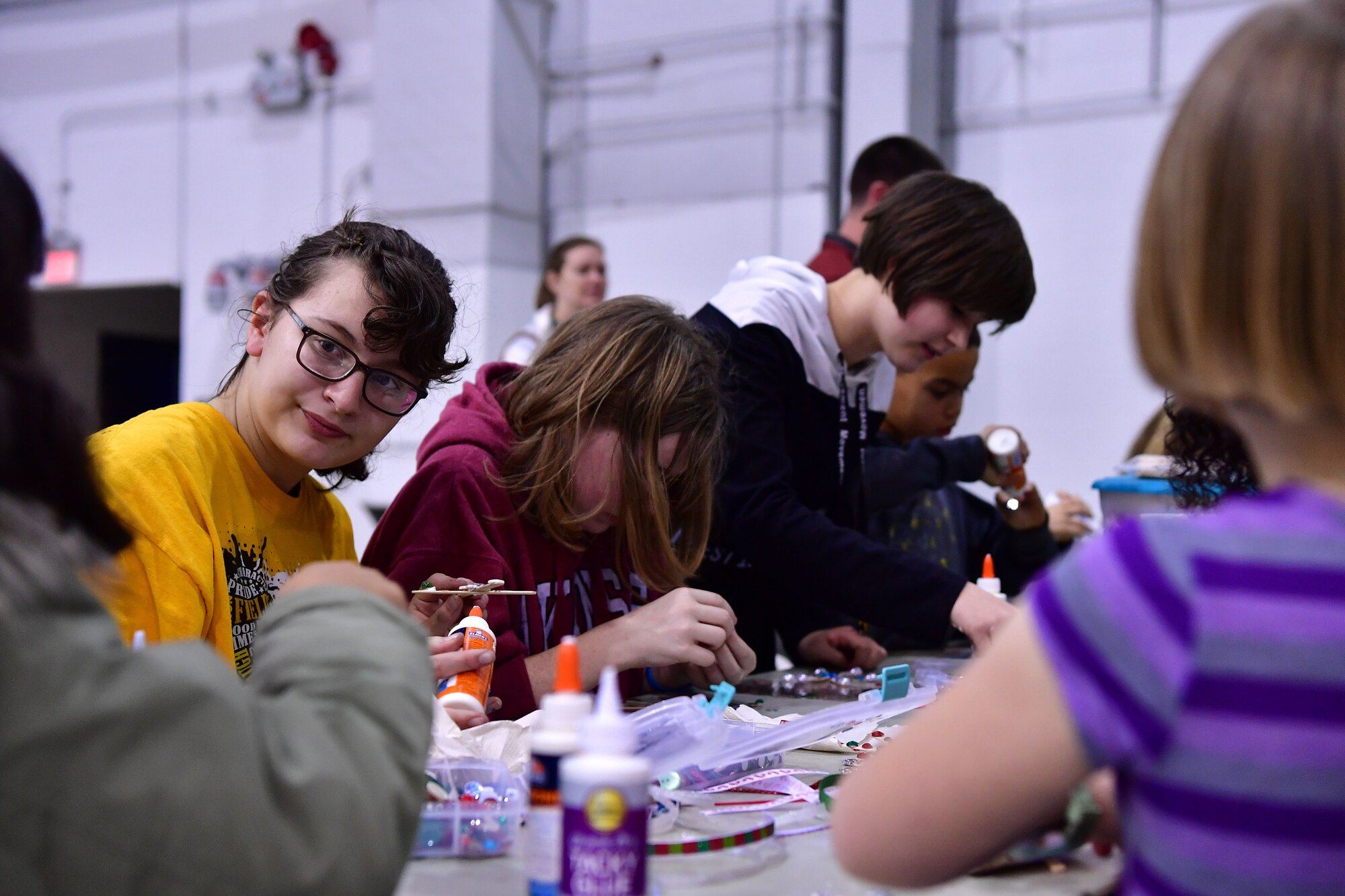 Children make cards for Santa at the crafting station during the Red-Nosed Herk holiday celebration.