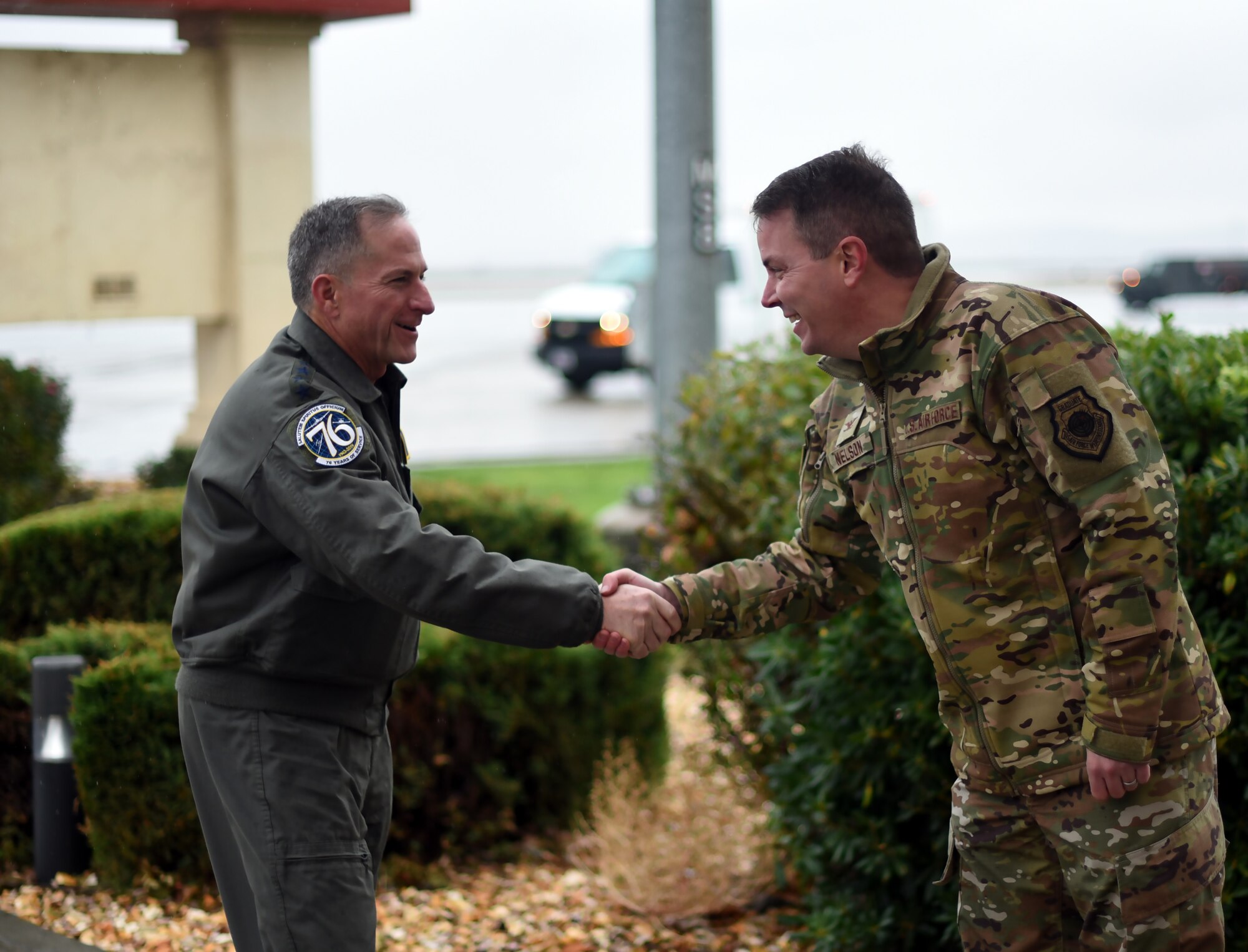 Air Force Chief of Staff Gen. David L. Goldfein greets Col. Jeff Nelson, 60th Air Mobility Wing commander.