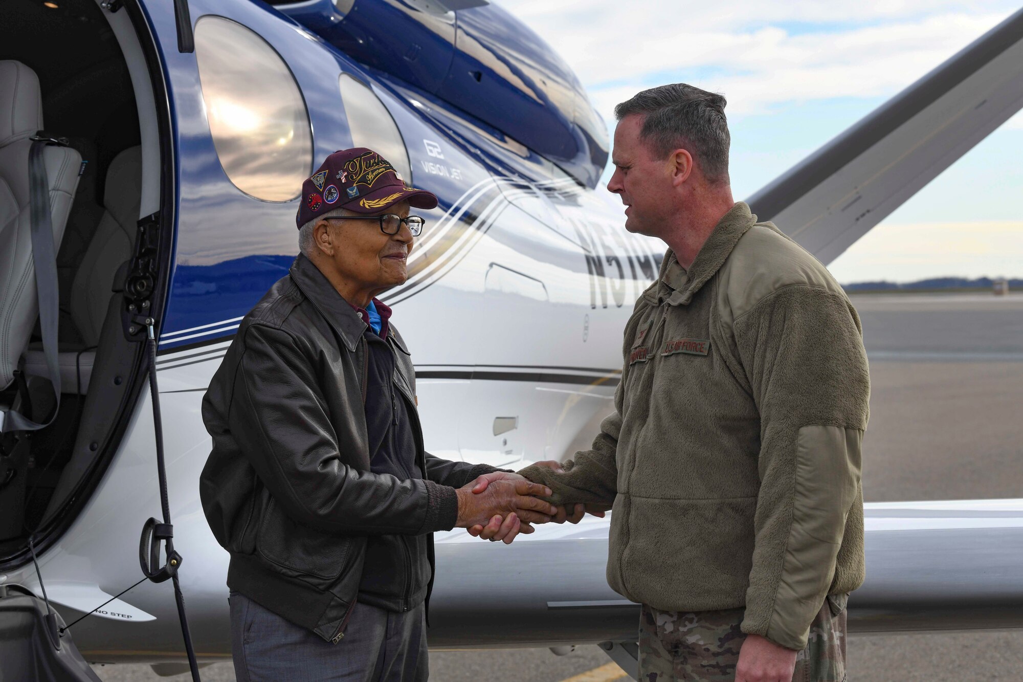 Former Tuskegee Airman, retired Col. Charles McGee, shakes 436th Airlift Wing commander Col. Joel Safranek’s hand during his visit Dec. 6, 2019, at Dover Air Force Base, Del. He served a total of 30 years in the U.S. Air Force, beginning with the U.S. Army Air Corps, and flew a total of 409 combat missions in World War II, Korea and Vietnam. The Tuskegee program began in 1941 when the 99th Pursuit Squadron was established, and its Airmen were the first ever African-American military aviators in the U.S. Army Air Corps. (U.S. Air Force photo by Senior Airman Christopher Quail)