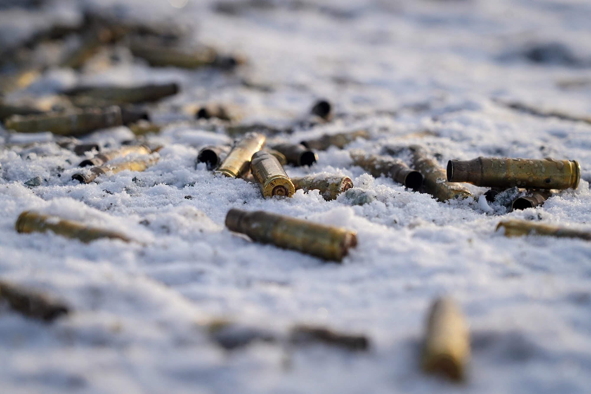 Expended 7.62mm casings are seen scattered on the ground as paratroopers assigned to the 2nd Battalion, 377th Parachute Field Artillery Regiment, 4th Infantry Brigade Combat Team (Airborne), 25th Infantry Division, U.S. Army Alaska, use M240B, and M2 machine guns while conducting live-fire qualification at Grezelka range, on Joint Base Elmendorf-Richardson, Alaska, Dec. 5, 2019. The Soldiers practiced identifying, and engaging targets at varying distances to solidify their proficiency with the weapons in sub-arctic conditions.