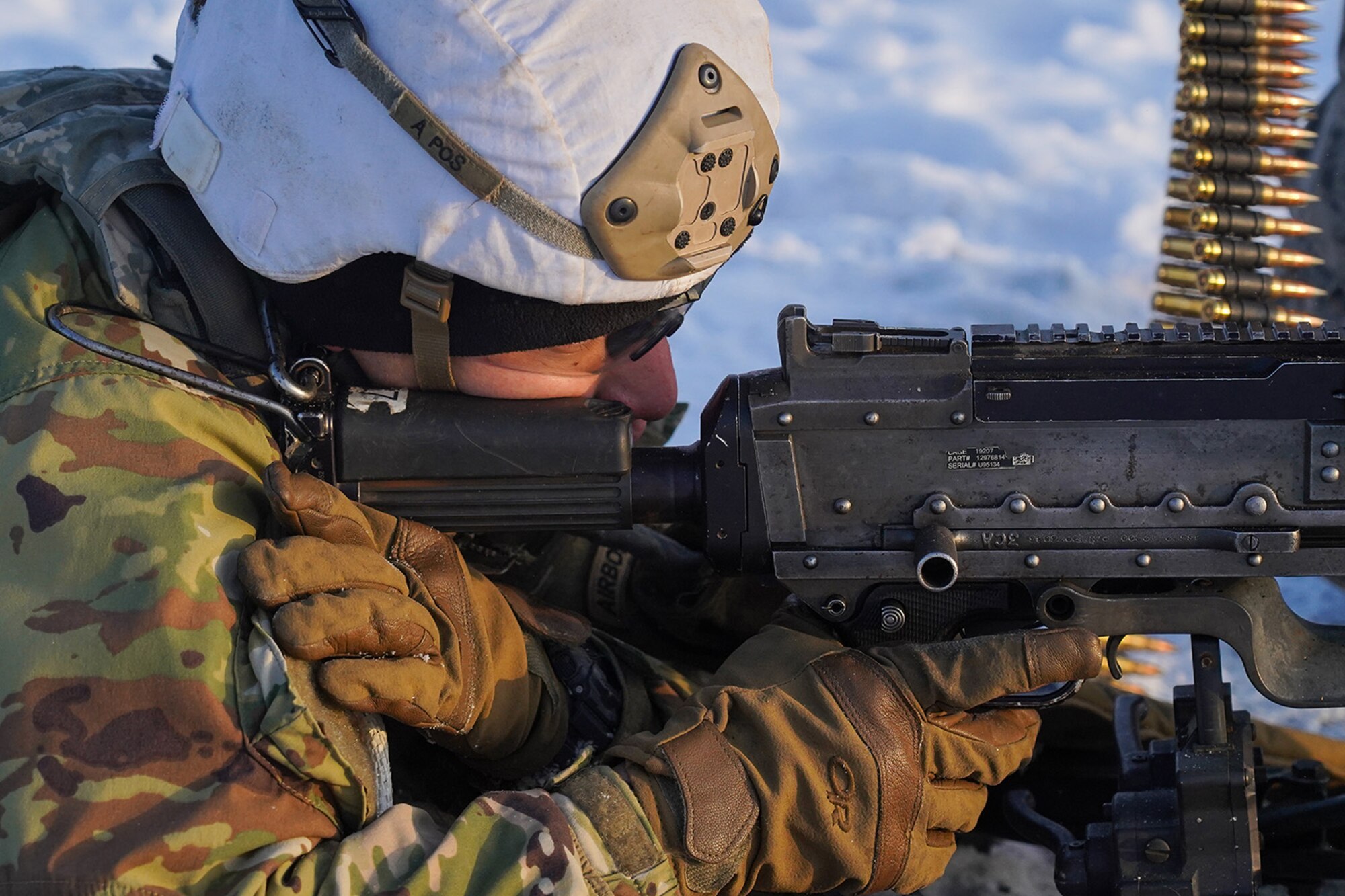 Army Pfc. John Paul Petrenko, a native of Jamaica, N.Y., a paratrooper assigned to the 2nd Battalion, 377th Parachute Field Artillery Regiment, 4th Infantry Brigade Combat Team (Airborne), 25th Infantry Division, U.S. Army Alaska, realignes his sight picture between bursts with an M240B machine gun while conducting live-fire qualification at Grezelka range, on Joint Base Elmendorf-Richardson, Alaska, Dec. 5, 2019. The Soldiers practiced identifying, and engaging targets at varying distances to solidify their proficiency with the weapons in sub-arctic conditions.