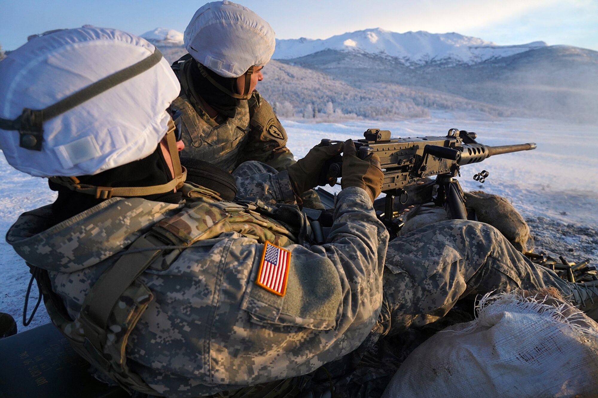 Paratroopers assigned to the 2nd Battalion, 377th Parachute Field Artillery Regiment, 4th Infantry Brigade Combat Team (Airborne), 25th Infantry Division, U.S. Army Alaska, fire an M2 machine gun while conducting live-fire qualification at Grezelka range, on Joint Base Elmendorf-Richardson, Alaska, Dec. 5, 2019. The Soldiers practiced identifying, and engaging targets at varying distances to solidify their proficiency with the weapons in sub-arctic conditions.
