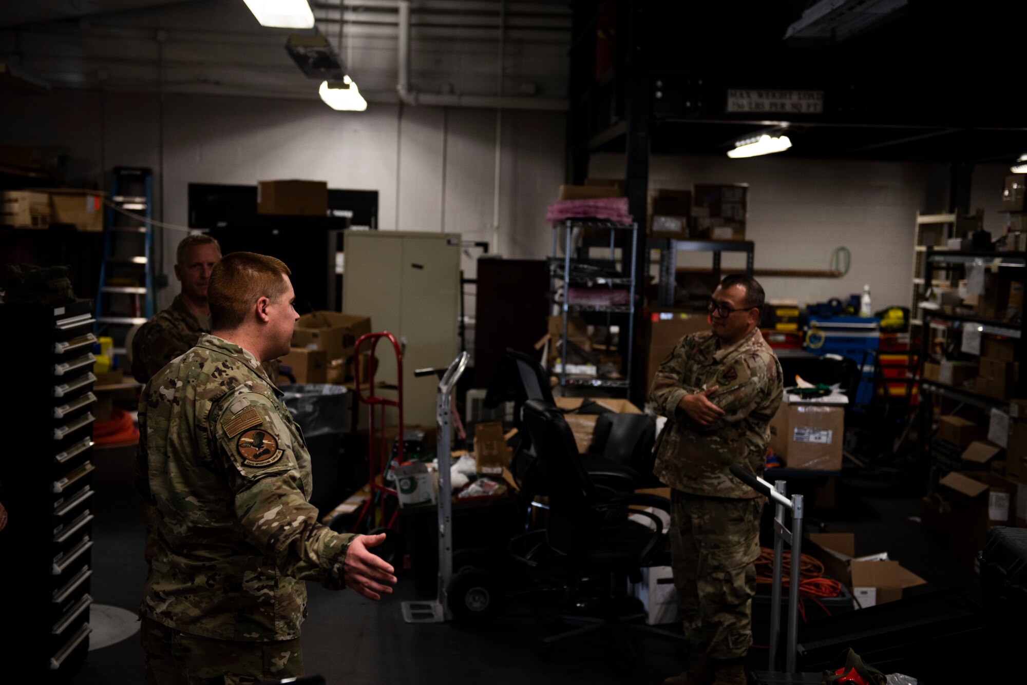U.S. Air Force Staff Sgt. Christopher Kiebach, 325th Operations Support Squadron Radar, Airfield, and Weather supervisor, left, briefs U.S. Air Force Col, Brian Laidlaw, 325th Fighter Wing commander, center, and U.S. Air Force Tech. Sgt. Richard Oliver, 325th OSS RAWS noncommissioned officer in charge at Tyndall Air Force Base, Florida, Nov. 26, 2019. Kiebach have a tour of the unit's work center to Laidlaw, discussed manning, operations, and the status for new and old equipment used for the base's mission. (U.S. Air Force photo by Staff Sgt. Magen M. Reeves)