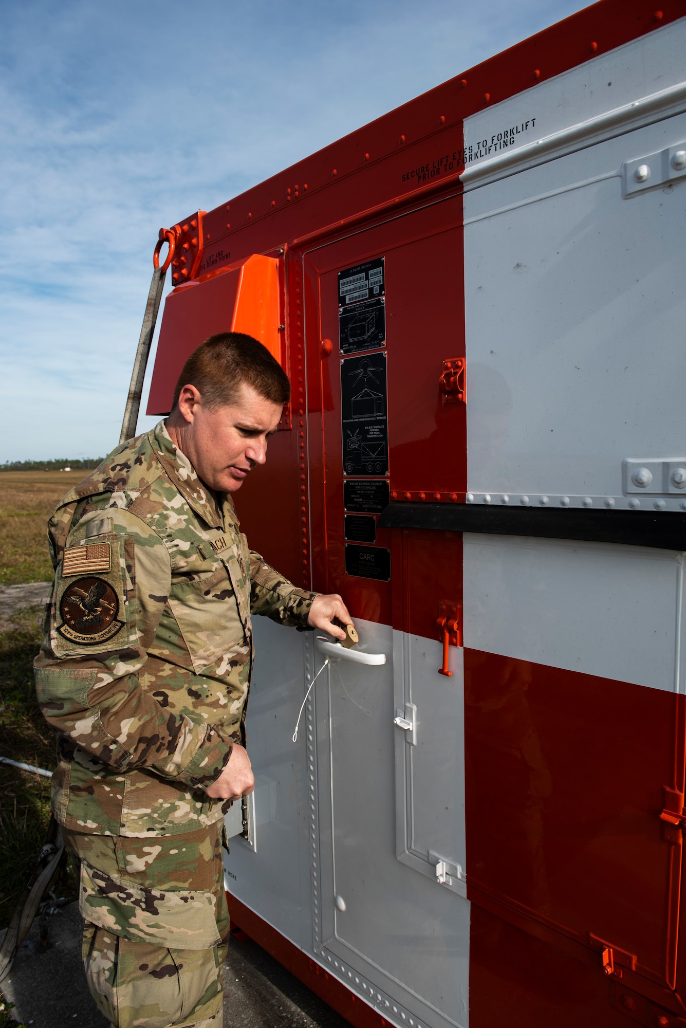 U.S. Air Force Staff Sgt. Christopher Kiebach, 325th Operations Support Squadron Radar, Airfield, and Weather Systems supervisor, locks up a critical resource at Tyndall Air Force Base, Florida, Nov. 26, 2019. Kiebach, originally from Sierra Vista, Arizona, was selected to represent the 325th Operations Group during the month's Airman Shadow program, which embeds with wing commander into a unit to see how Airmen perform day-to-day duties in support of the 325th Fighter Wing mission. (U.S. Air Force photo by Staff Sgt. Magen M. Reeves)
