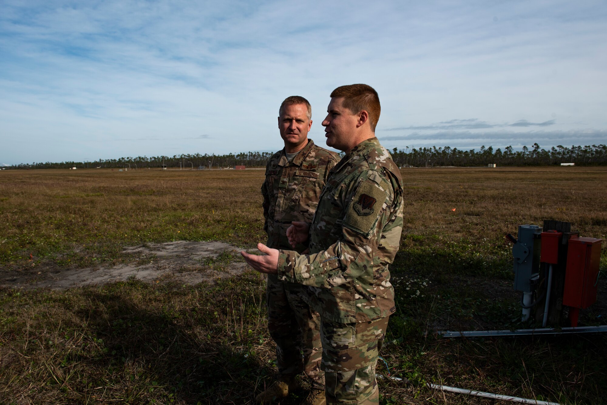 U.S. Air Force Col. Brian Laidlaw, 325th Fighter Wing commander, left, talks to U.S. Air Force Staff Sgt. Christopher Kiebach, 325th Operations Support Squadron Radar, Airfield, and Weather Systems supervisor at Tyndall Air Force Base, Florida, Nov. 26, 2019. Kiebach and his team maintain air traffic and control systems for Tyndall including all means of communication from air traffic controllers to aircraft operators via radio, as well as interagency communication via telephones. (U.S. Air Force photo by Staff Sgt. Magen M. Reeves)