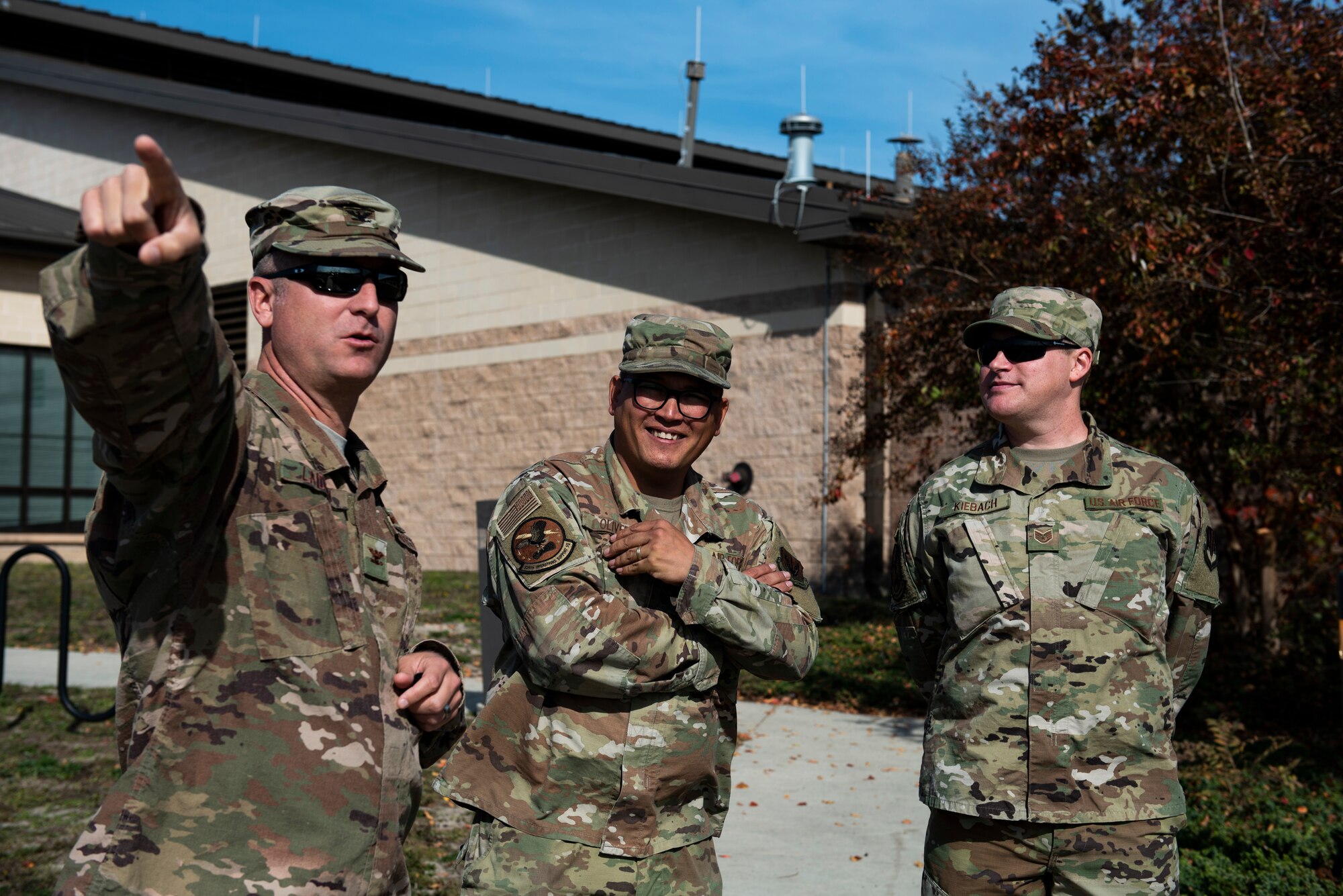 U.S. Air Force Col. Brian Laidlaw, 325th Fighter Wing commander, left, points toward a location with U.S. Air Force Tech. Sgt. Richard Oliver, 325th Operations Support Squadron Radar, Airfield, and Weather Systems noncommissioned officer in charge, center, and U.S. Air Force Staff Sgt. Christopher Kiebach, 325th OSS RAWS supervisor at Tyndall Air Force Base, Florida, Nov. 26, 2019. Kiebach had been selected by the 325th Operations Group to showcase his duty specialty to the wing commander as part of the wing's Airman Shadow program. (U.S. Air Force photo by Staff Sgt. Magen M. Reeves)