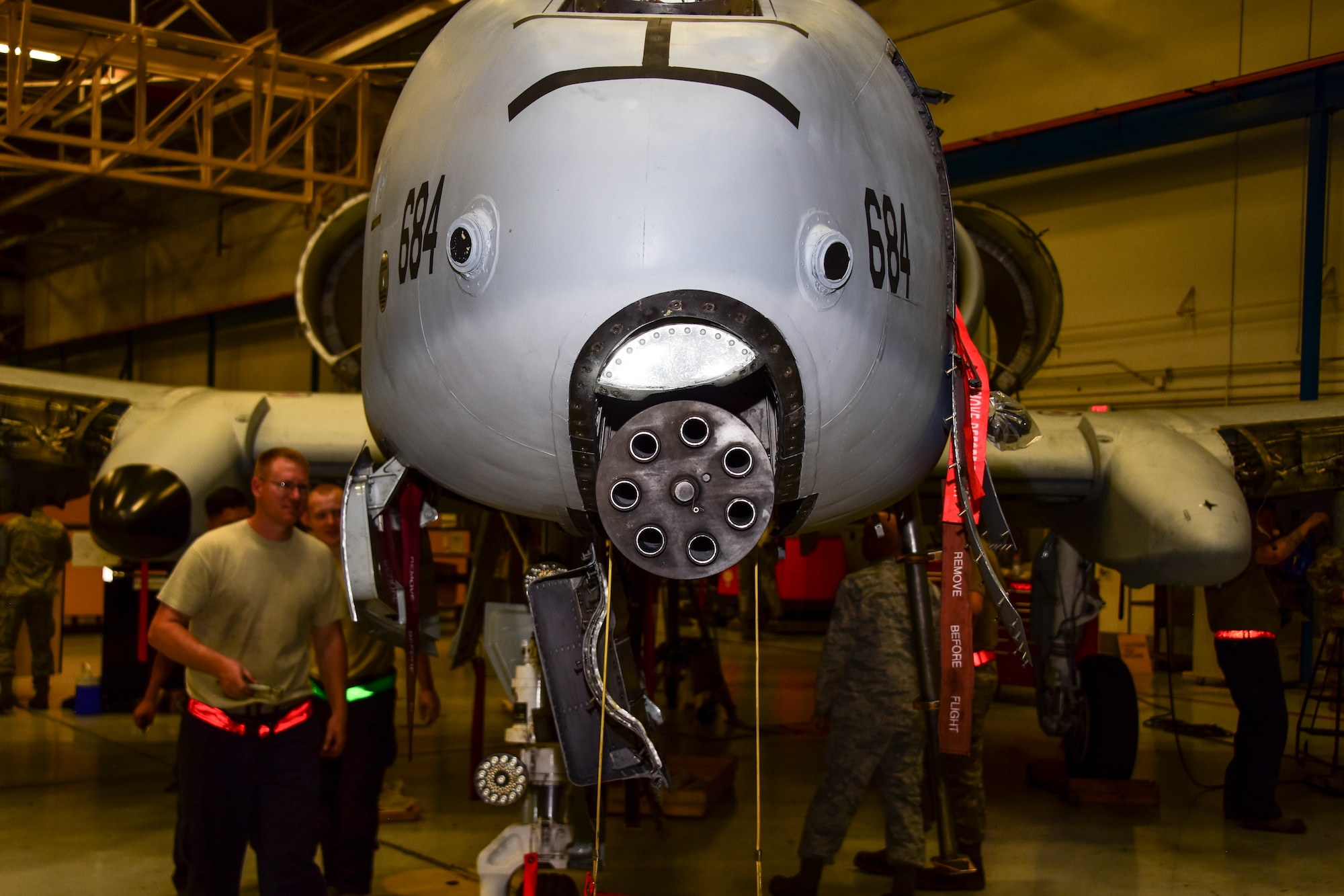 A photo of an A-10 siting in maintenance hangar