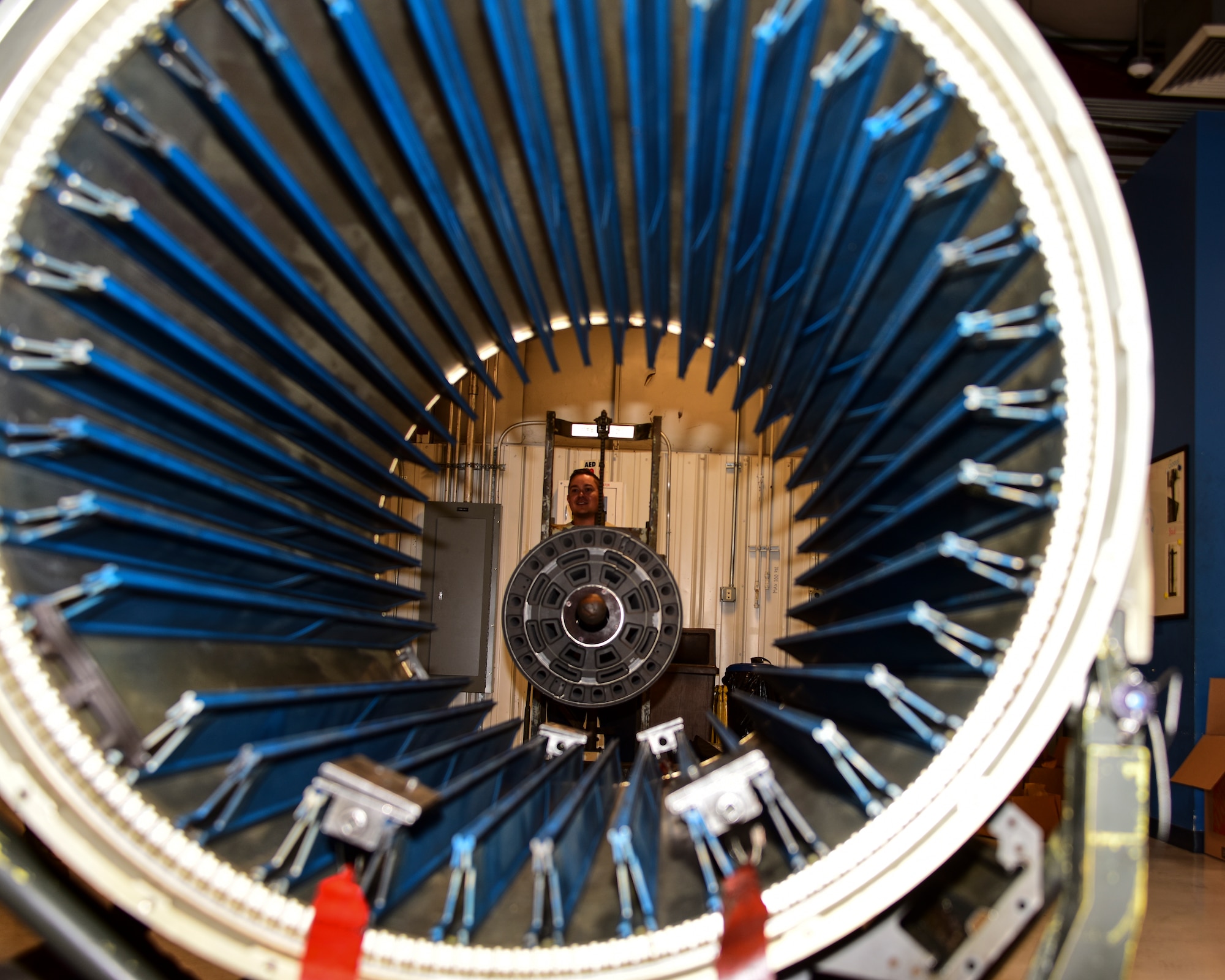 a photo of Airmen working on a Gatling gun