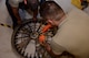 A photo of Airmen rebuilding a Gatling gun