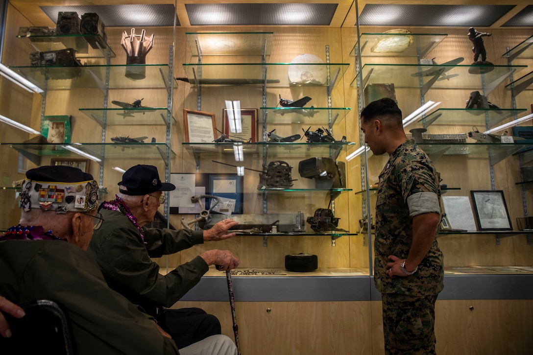 Donald Long, retired U.S. Navy radio operator, speaks with U.S. Marine Corps Col. Raul Lianez, commanding officer, Marine Corps Base Hawaii (MCBH) about the events of Pearl Harbor during his visit, MCBH, Dec. 5, 2019. The Best Defense Foundation returned 6 WWII Pearl Harbor and Naval Air Station Kaneohe Bay survivors to Hawaii for the 78th Commemoration of Pearl Harbor and Naval Air Station Kaneohe Bay which is now MCBH. The heroes returned were Jack Holder (97) US NAVY - Naval Air Station, Kaneohe Bay; Tom Foreman (98) US Navy - USS Cushing; Ira Schab (99) US Navy - USS Dobbin; Stuart Hedley (98) US Navy - USS West Virginia; Donald Long (98) US Navy - Naval Air Station, Kaneohe Bay; and Chuck Kohler (96) US Navy - USS Hornet. (U.S. Marine Corps photo by Cpl. Matthew Kirk)