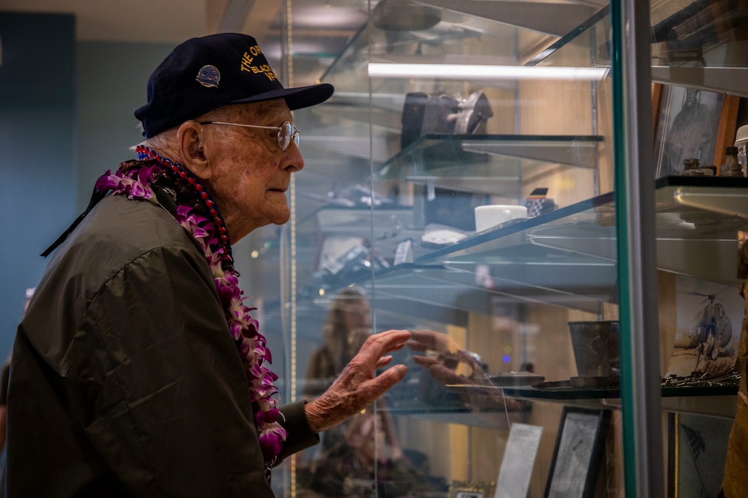 Donald Long, retired U.S. Navy radio operator, looks at a display case during his visit, Marine Corps Base Hawaii (MCBH), Dec. 5, 2019. The Best Defense Foundation returned 6 WWII Pearl Harbor and Naval Air Station Kaneohe Bay survivors to Hawaii for the 78th Commemoration of Pearl Harbor and Naval Air Station Kaneohe Bay which is now MCBH. The heroes returned were Jack Holder (97) US NAVY - Naval Air Station, Kaneohe Bay; Tom Foreman (98) US Navy - USS Cushing; Ira Schab (99) US Navy - USS Dobbin; Stuart Hedley (98) US Navy - USS West Virginia; Donald Long (98) US Navy - Naval Air Station, Kaneohe Bay; and Chuck Kohler (96) US Navy - USS Hornet. (U.S. Marine Corps photo by Cpl. Matthew Kirk)