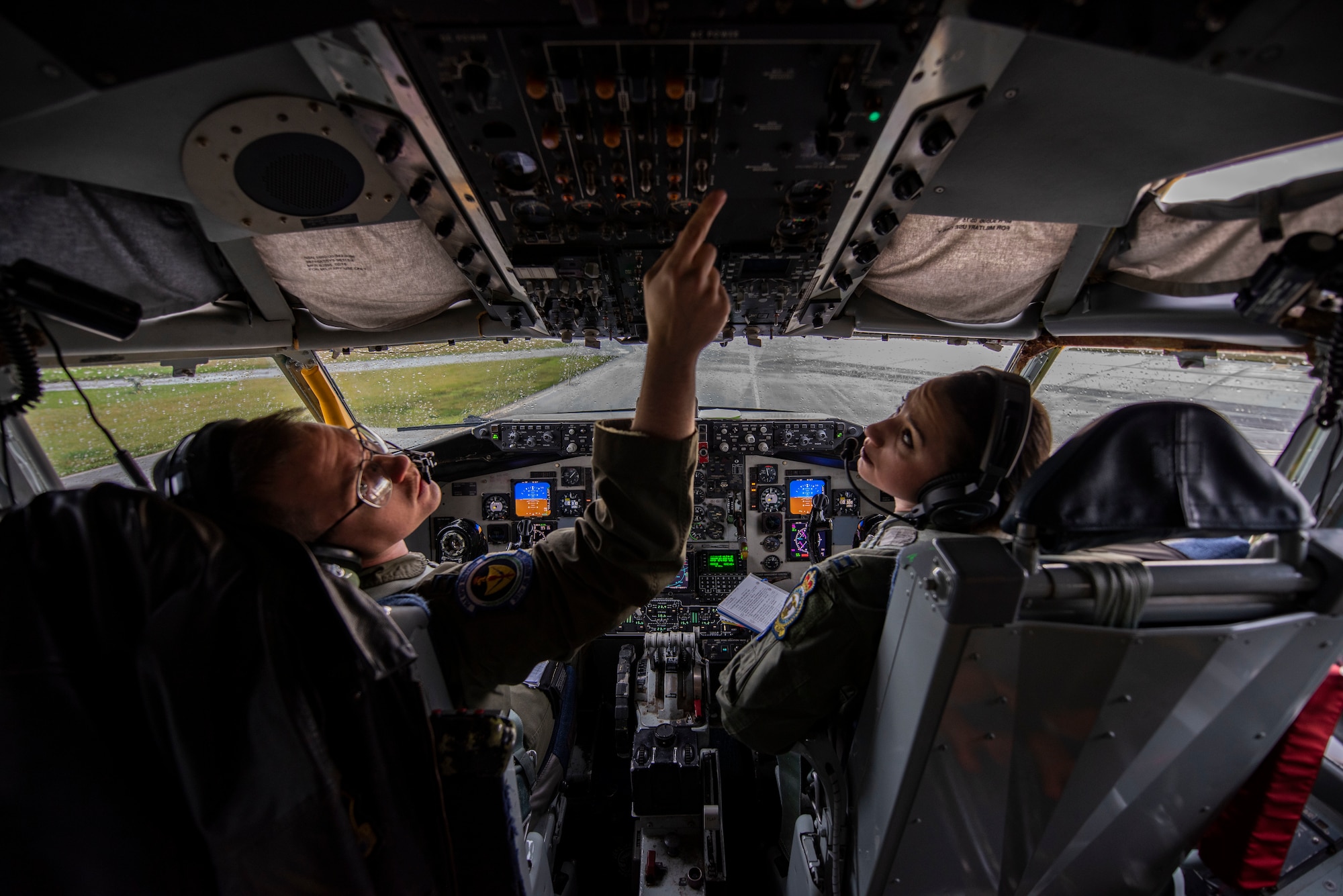 Capt. Grant Starkweather and Capt. Jori Ingersoll, 351st Air Refueling Squadron pilots, conduct pre-flight checks aboard a KC-135 Stratotanker at RAF Mildenhall, England, Nov. 14, 2019. The pilots flew an aerial refueling mission in support of Exercise Point Blank. (U.S. Air Force photo by Airman 1st Class Joseph Barron)