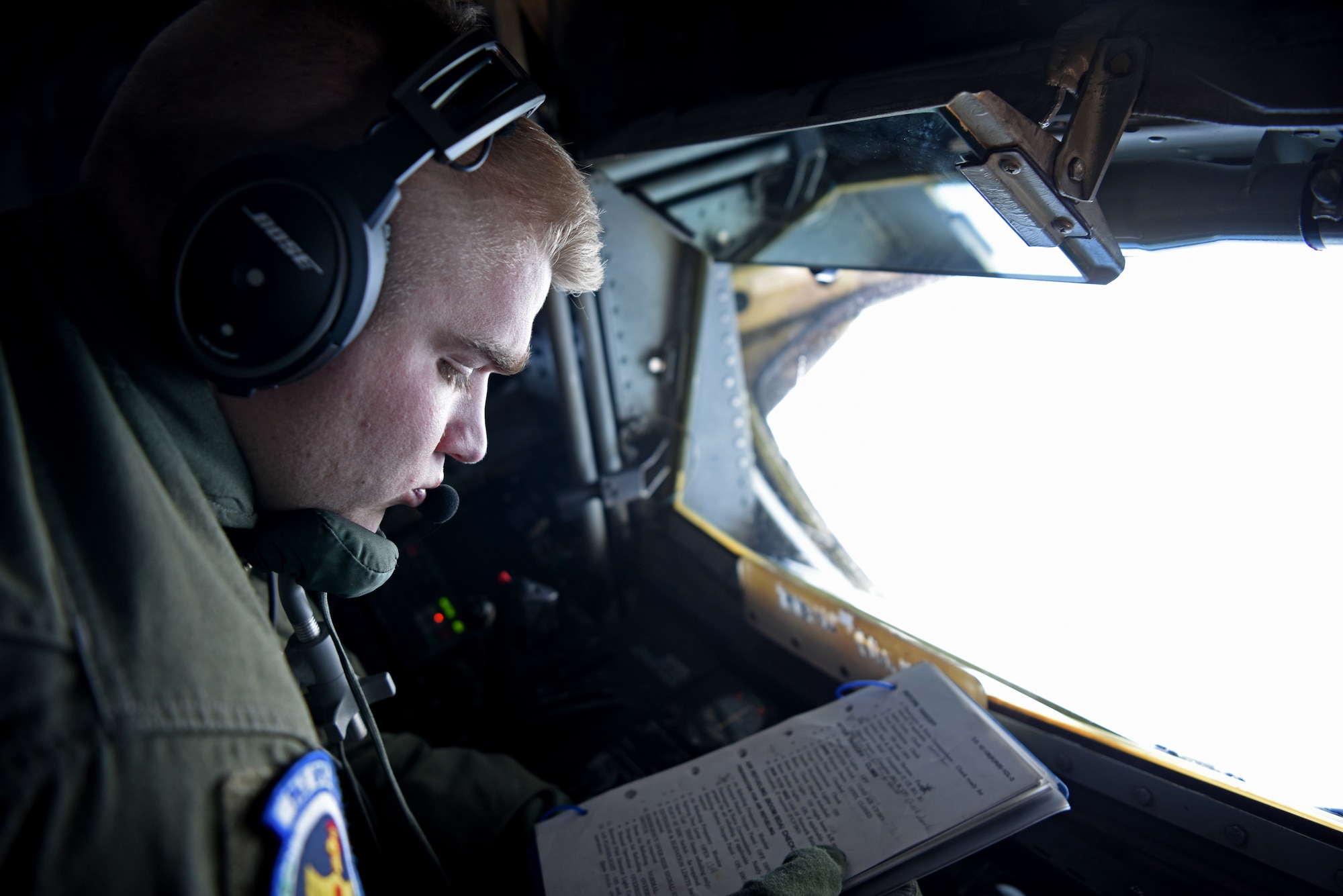 U.S. Air Force Airman 1st Class Alex Bengel, 351st Air Refueling Squadron boom operator, performs aerial refueling checklist during exercise Astral Knight over the skies of Italy, June 3, 2019. AK19 is a joint, multinational exercise designed to test Integrated Air and Missile Defense capabilities and will involve a combination of flight operations and computer-assisted exercise scenarios. Participants include the U.S. Air Forces in Europe, U.S. Army Europe forces, and members from the Italian and Croatian air forces. (U.S. Air Force photo by Airman 1st Class Brandon Esau)