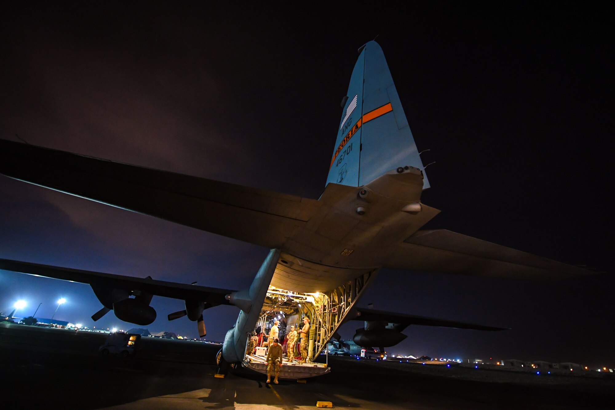 Airmen finalize pre-flight inspections on a C-130 Hercules