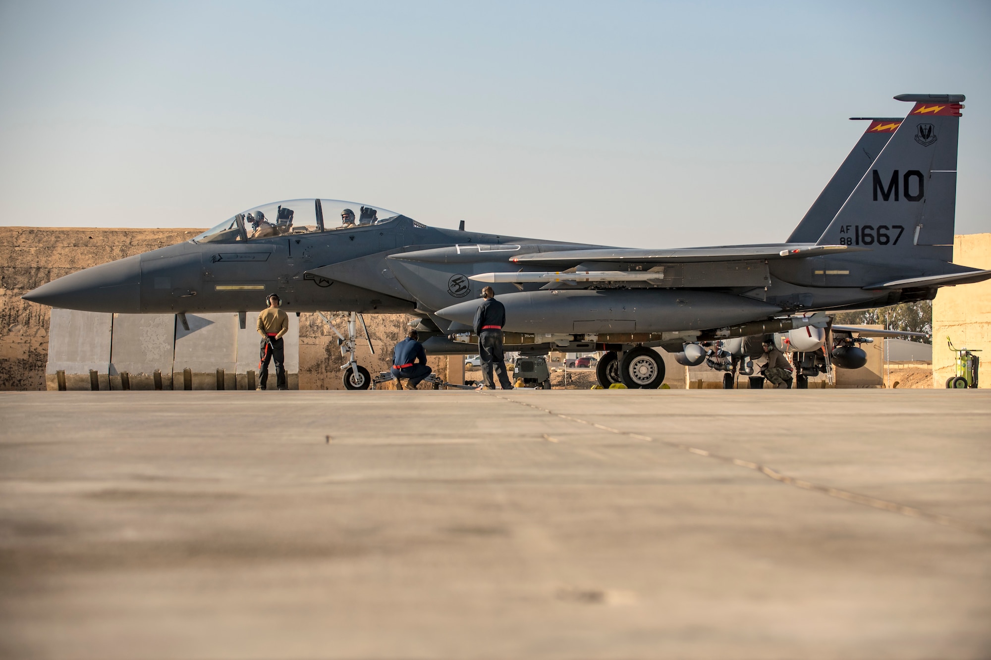 Crew chiefs recover an F-15E Strike Eagle after flight