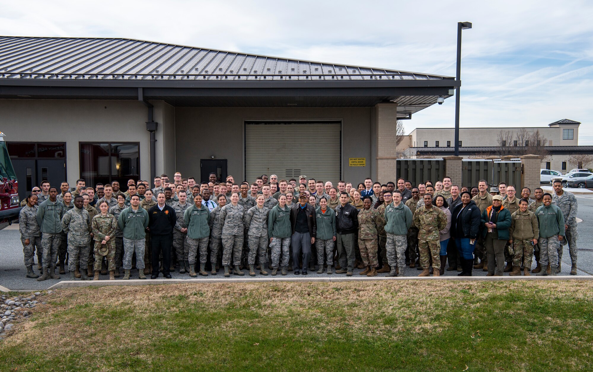 Former Tuskegee Airman, retired Col. Charles McGee, poses with Team Dover Airmen for a group photo during his visit Dec. 6, 2019, at Dover Air Force Base, Del. He served a total of 30 years in the U.S. Air Force, beginning with the U.S. Army Air Corps, and flew a total of 409 combat missions in World War II, Korea and Vietnam. The Tuskegee program began in 1941 when the 99th Pursuit Squadron was established, and its Airmen were the first ever African-American military aviators in the U.S. Army Air Corps. (U.S. Air Force photo by Senior Airman Christopher Quail)