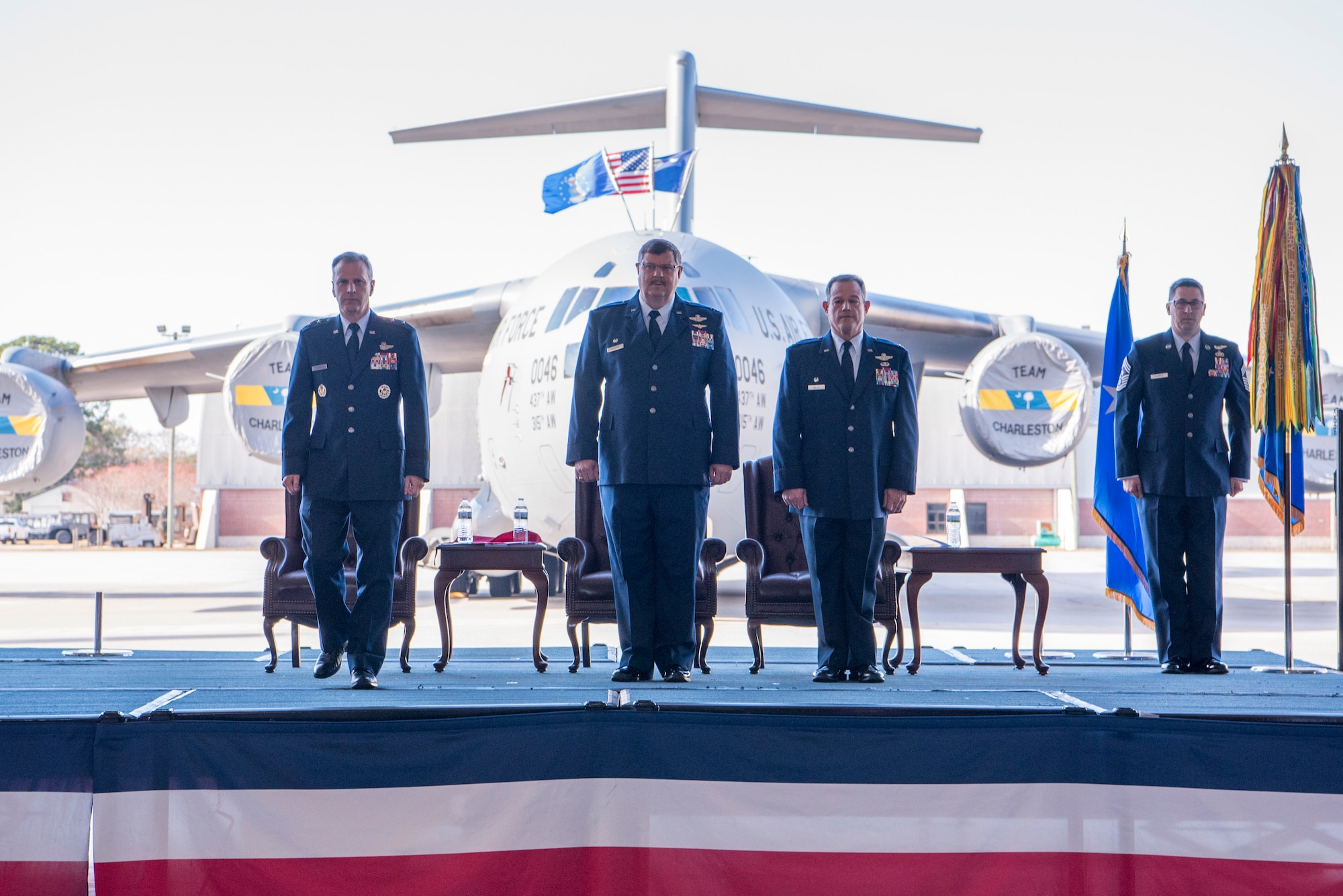 Maj. Gen. Randall Ogden, left, U.S. Air Force 4th Air Force Commander, Col. Gregory Gilmour, second to the left, outgoing 315th Airlift Wing Commander, Col. Adam Willis,third to the left, incoming 315th Airlift Wing commander, and Chief Master Sgt. John-Paul Burke, Command Chief Master Sergeant of the 315th Airlift Wing, stand for the begining of a change of command ceremony at Nose Dock 2 here, Dec. 7. Willis replaced Col. Gregory Gilmour, as the 315th Airlift Wing commander