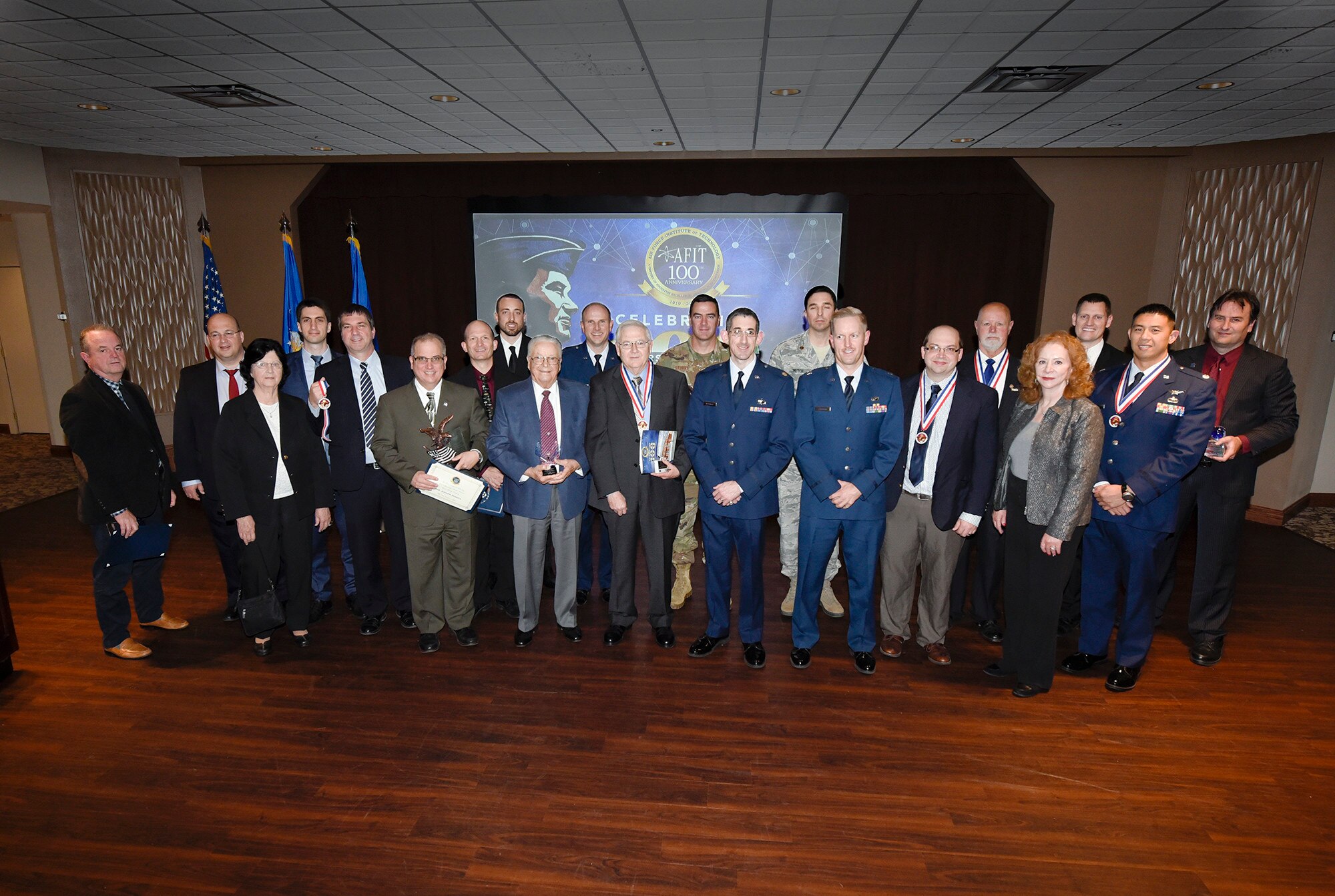 The Air Force Institute of Technology hosted an awards ceremony in conjunction with their Centennial celebration events on Nov. 7. The ceremony highlighted the accomplishments of alumni, faculty and staff who distinguished themselves in support of AFIT’s mission to provide defense focused graduate and professional continuing education to the U.S. Air Force. (U.S. Air Force photo by Tyler Greenlees)