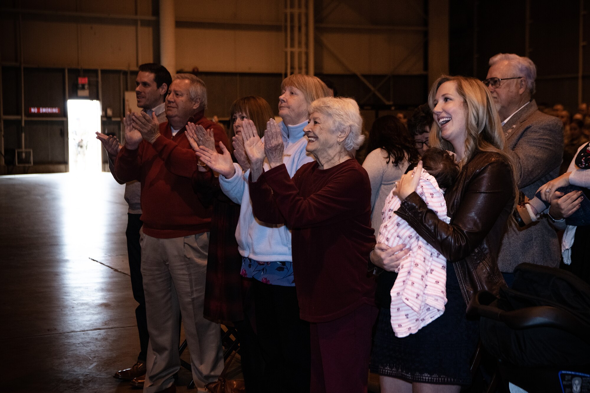 The family and friends of Master Sgt. Bryan Whittle, assigned to the 205th Engineering and Installation Squadron, celebrate as Whittle receives his Airman’s Medal during a ceremony at Will Rogers Air National Guard Base in Oklahoma City, Dec. 8, 2019. The Airman’s Medal is the highest noncombat award given in the Air Force and awarded to service members who distinguish themselves by a heroic act, usually at the voluntary risk of their own life. (U.S. Air National Guard photo by Staff Sgt. Jordan Martin)
