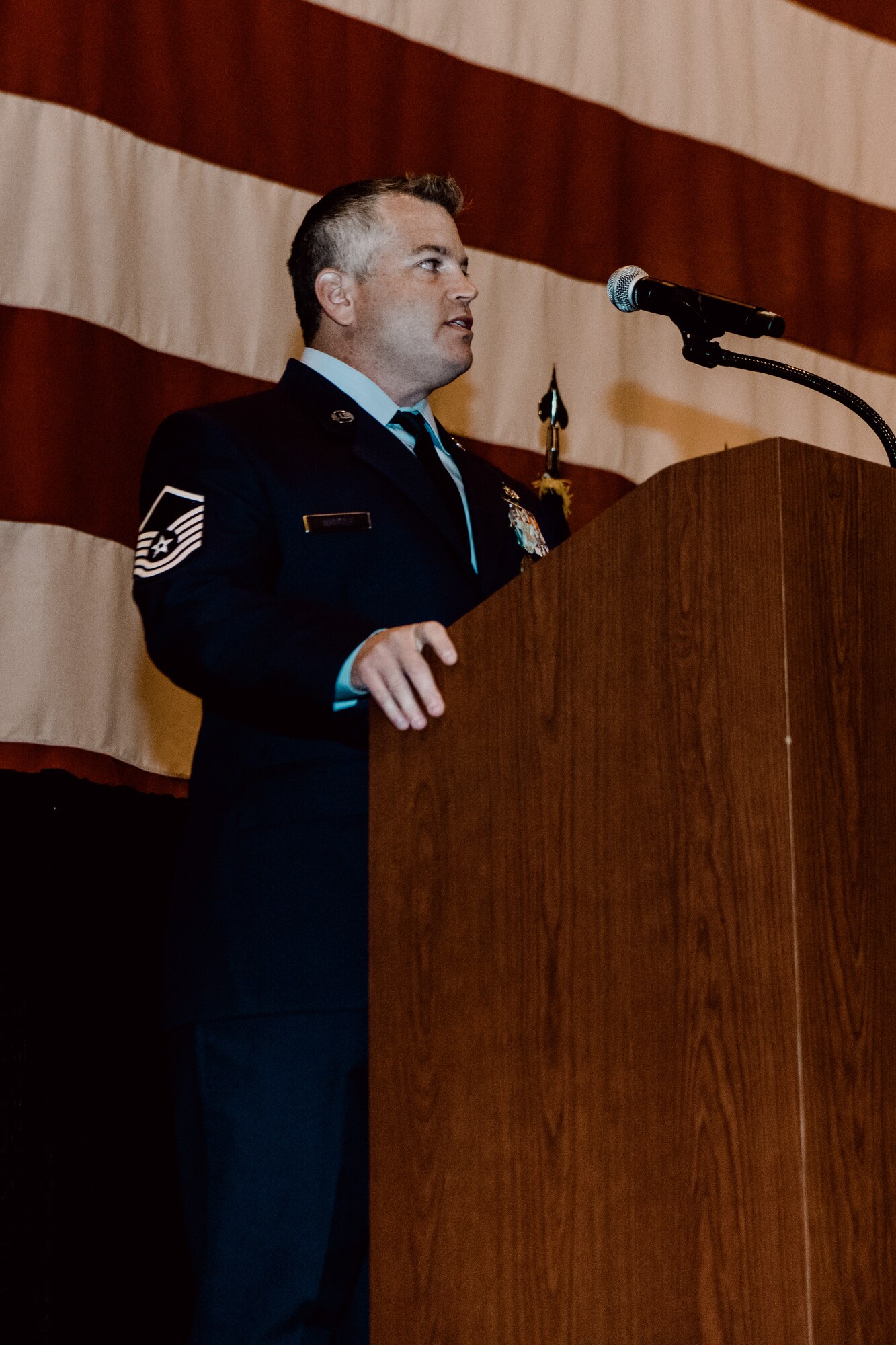 Master Sgt. Bryan Whittle, assigned to the 205th Engineering and Installation Squadron, talks about the honor of receiving the Airman’s Medal during a ceremony at Will Rogers Air National Guard Base in Oklahoma City, Dec. 8, 2019. Whittle received the award for his heroic actions that prevented an active shooter from taking innocent lives. (U.S. Air National Guard photo by Staff Sgt. Jordan Martin)