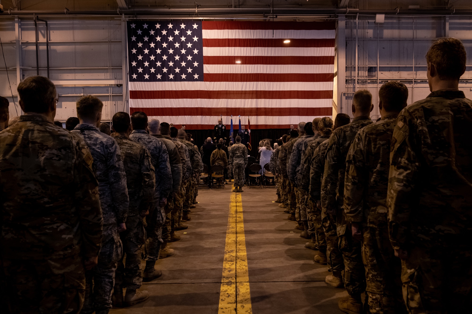 Members of the 137th Special Operations Wing stand at attention and observe as Master Sgt. Bryan Whittle, assigned to the 205th Engineering and Installation Squadron, is presented with the Airman’s Medal during a ceremony at Will Rogers Air National Guard Base in Oklahoma City, Dec. 8, 2019. The Airman’s Medal is the highest noncombat award given in the Air Force and awarded to service members who distinguish themselves by a heroic act, usually at the voluntary risk of their own life. (U.S. Air National Guard photo by Staff Sgt. Brigette Waltermire)