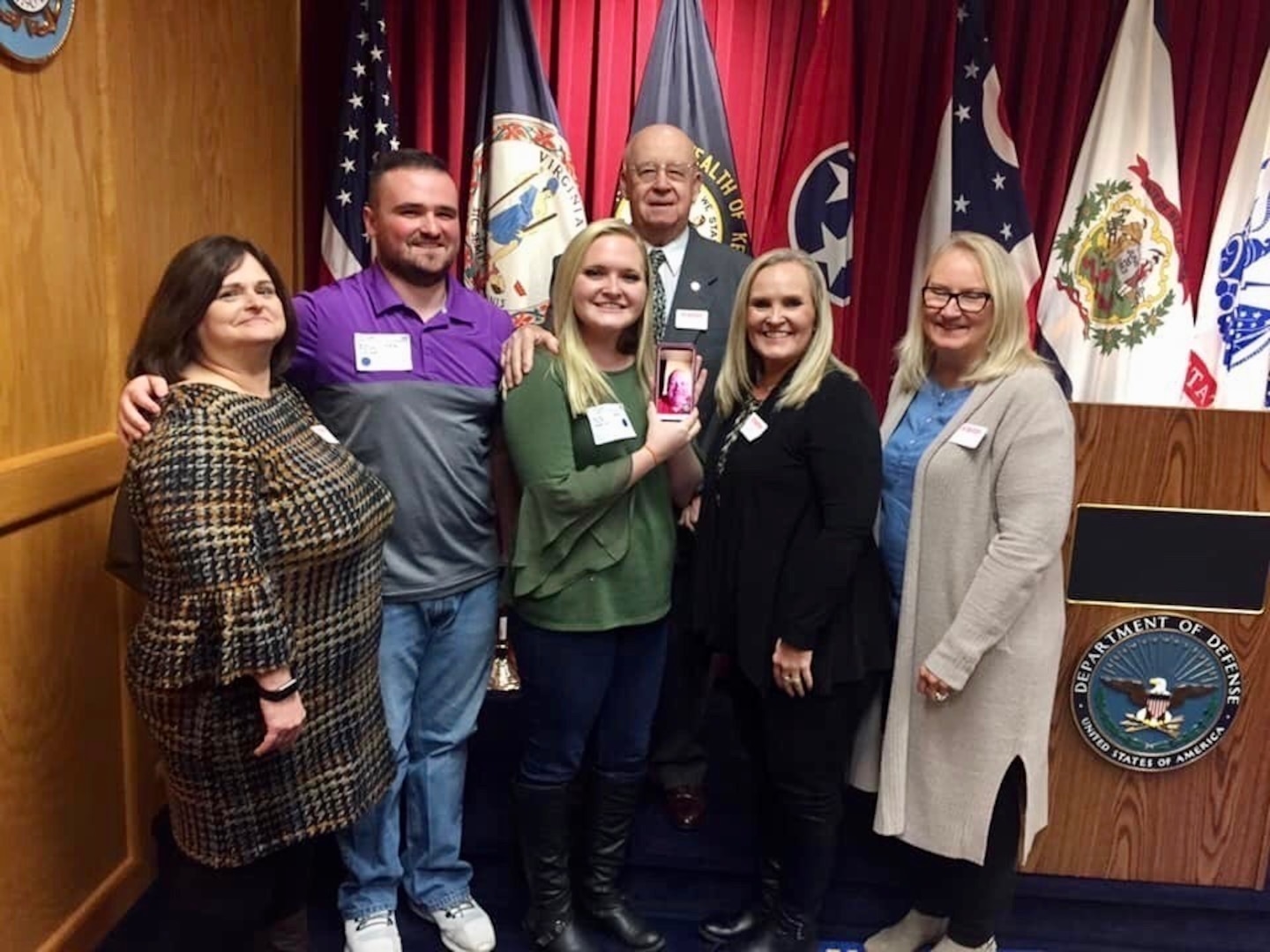 Tyler Phillips stands with his family after taking the oath of enlistment from his grandfather Daniel Phillips, a former Troop Commander in the 1-150th Cavalry Regiment, West Virginia Army National Guard.