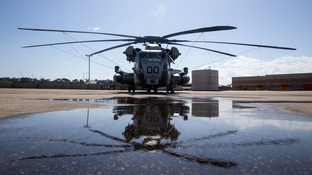 A CH-53E Super Stallion helicopter assigned to Marine Heavy Helicopter Squadron 366 is staged on the flight line during Exercise Raven 20-1 at Gulfport, Mississippi, Oct. 10, 2019. Exercise Raven 20-1 is a joint integrated training exercise between Marine Forces Special Operations Command and HMH- 366 with a focus on improving unit readiness and interoperablity. HMH-366 is a part of Marine Aircraft Group 29, 2nd Marine Aircraft Wing.
