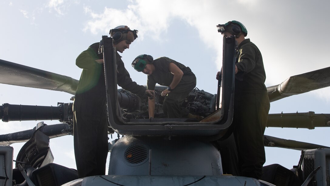 Marines with Marine Heavy Helicopter Squadron 366 inspect rotor hydraulics of a CH-53E Super Stallion helicopter during Exercise Raven 20-1 at Gulfport, Mississippi, Oct. 10, 2019. Exercise Raven 20-1 is a joint integrated training exercise between Marine Forces Special Operations Command and HMH-366 with a focus on improving unit readiness and interoperablity. HMH-366 is a part of Marine Aircraft Group 29, 2nd Marine Aircraft Wing.