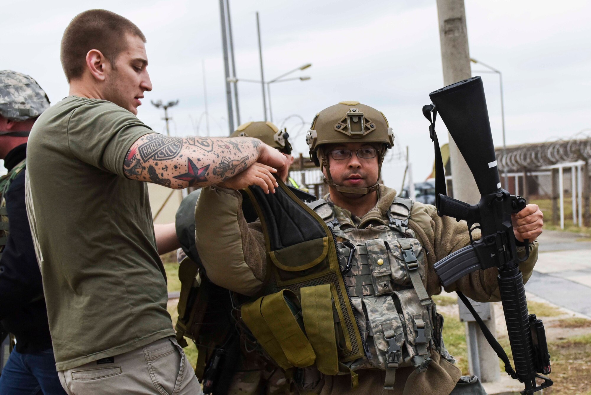 U.S. Air Force Senior Airman Cameron Foley, 39th Security Forces Squadron staff armorer, places body armor on U.S. Air Force Staff Sgt. Richard Figueroa, 39th SFS non-commissioned officer in charge of physical security, during an exercise Nov. 27, 2019, at Incirlik Air Base, Turkey. Body armor plays a crucial role in protecting members during missions. (U.S. Air Force photo by Staff Sgt. Joshua Magbanua)