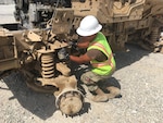 Navy Petty Officer Second Class Jhunar Medenilla, a new PACE member, performs an ammo abatement inspection on a vehicle during his recent deployment to DLA Disposition Services site at Bagram Airfield, Afghanistan.