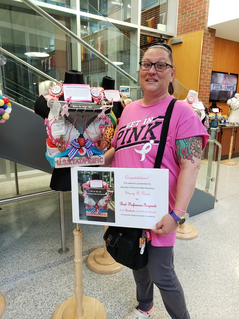 Norfolk Naval Shipyard's Stacey Dunn won the grand prize during the twelfth annual Bra-Ha-Ha Awards Show and Auction Oct. 18 for her design entitled ‘Abreast of Routine Maintenance’.