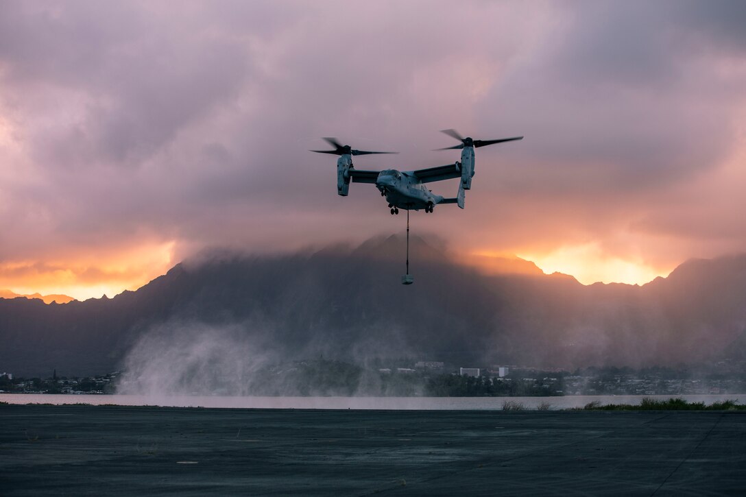 A MV-22B Osprey attached to Marine Medium Tiltrotor Squadron 363, Marine Aircraft Group 24, carries a cement block during an external lift exercise, Marine Corps Base Hawaii, Dec. 3, 2019. VMM-363 conducted an external lift exercise in order to increase readiness between the landing support Marines of Combat Logistics Battalion 3 and the squadron.