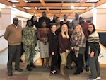 Members of the Construction and Equipment supply chain’s Culture Improvement Team pose with Capt. Jacqueline Meyer, the supply chain director, during the group’s holiday luncheon. The event was held Dec. 5, 2019 at the Defense Logistics Agency Troop Support Headquarters in Philadelphia.