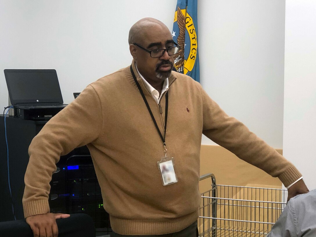 Steven McLane, a material planner in the Construction and Equipment supply chain, addresses the Culture Improvement Team at the start of the holiday luncheon. The event was held Dec. 5, 2019 at the Defense Logistics Agency Troop Support Headquarters in Philadelphia.