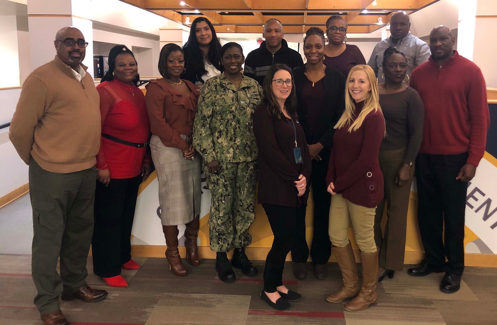 Members of the Construction and Equipment supply chain’s Culture Improvement Team pose with Capt. Jacqueline Meyer, the supply chain director, during the group’s holiday luncheon. The event was held Dec. 5, 2019 at the Defense Logistics Agency Troop Support Headquarters in Philadelphia.