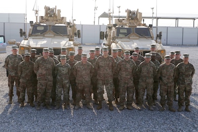Soldiers from the Syrian Logistics Cell, 103rd Expeditionary Sustainment Command, pose for a group photo Erbil, Iraq, Dec. 1, 2019. (U.S. Army Reserve photo by Spc. Dakota Vanidestine)