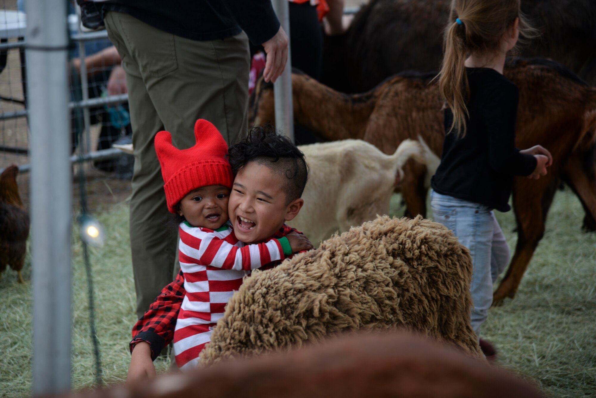 a photo of Two kids celebrating during a base holiday event.