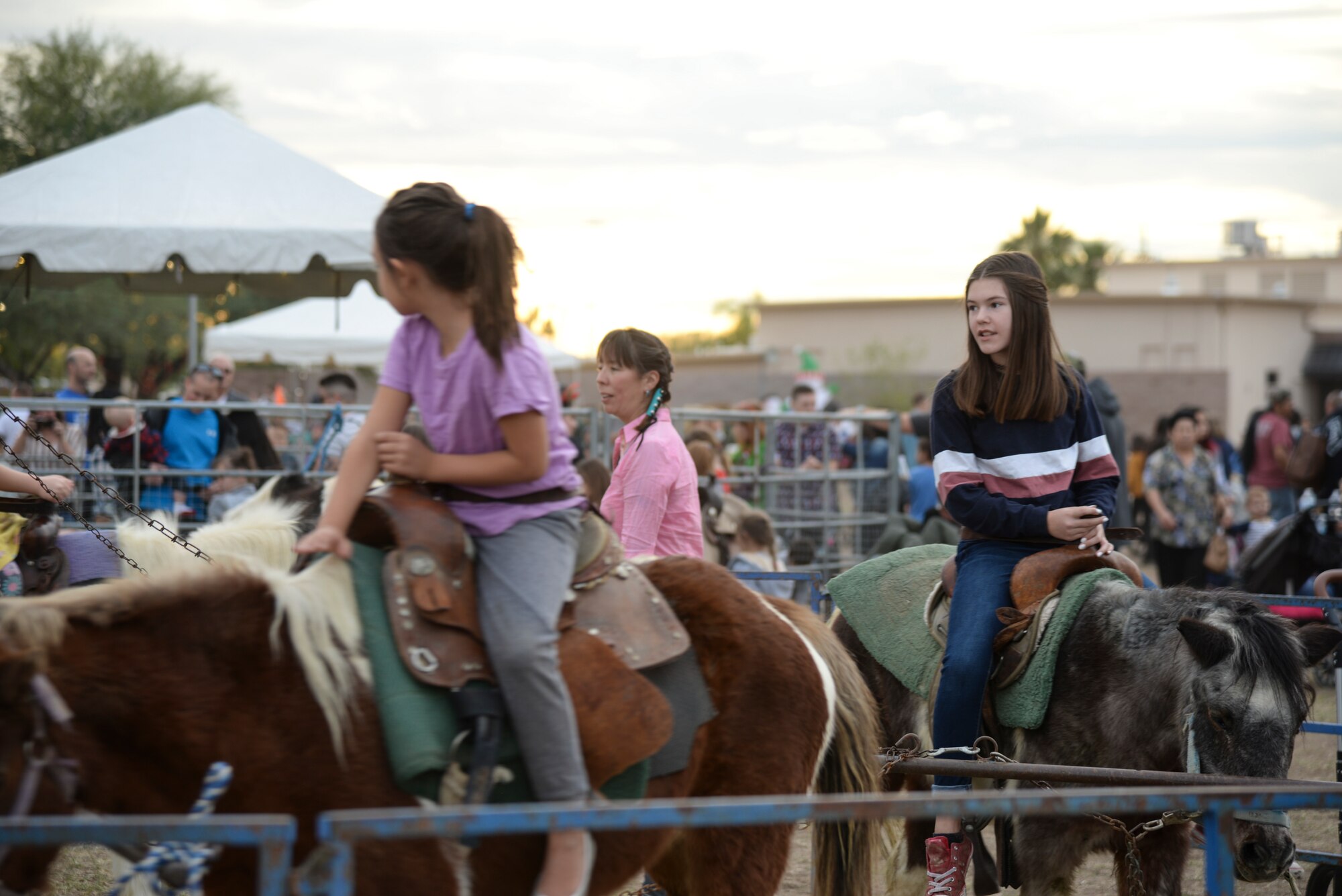 a photo of Children riding horses during a base holiday event.