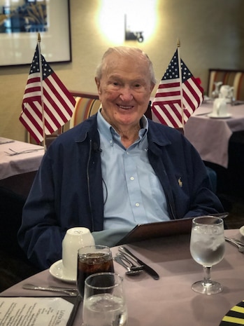 U.S. Marine veteran John Campbell, a World War II pilot and Pearl Harbor survivor awaits his lunch during a Veterans Day Luncheon at La Vida Del Mar in Solana Beach, California, Dec. 6.