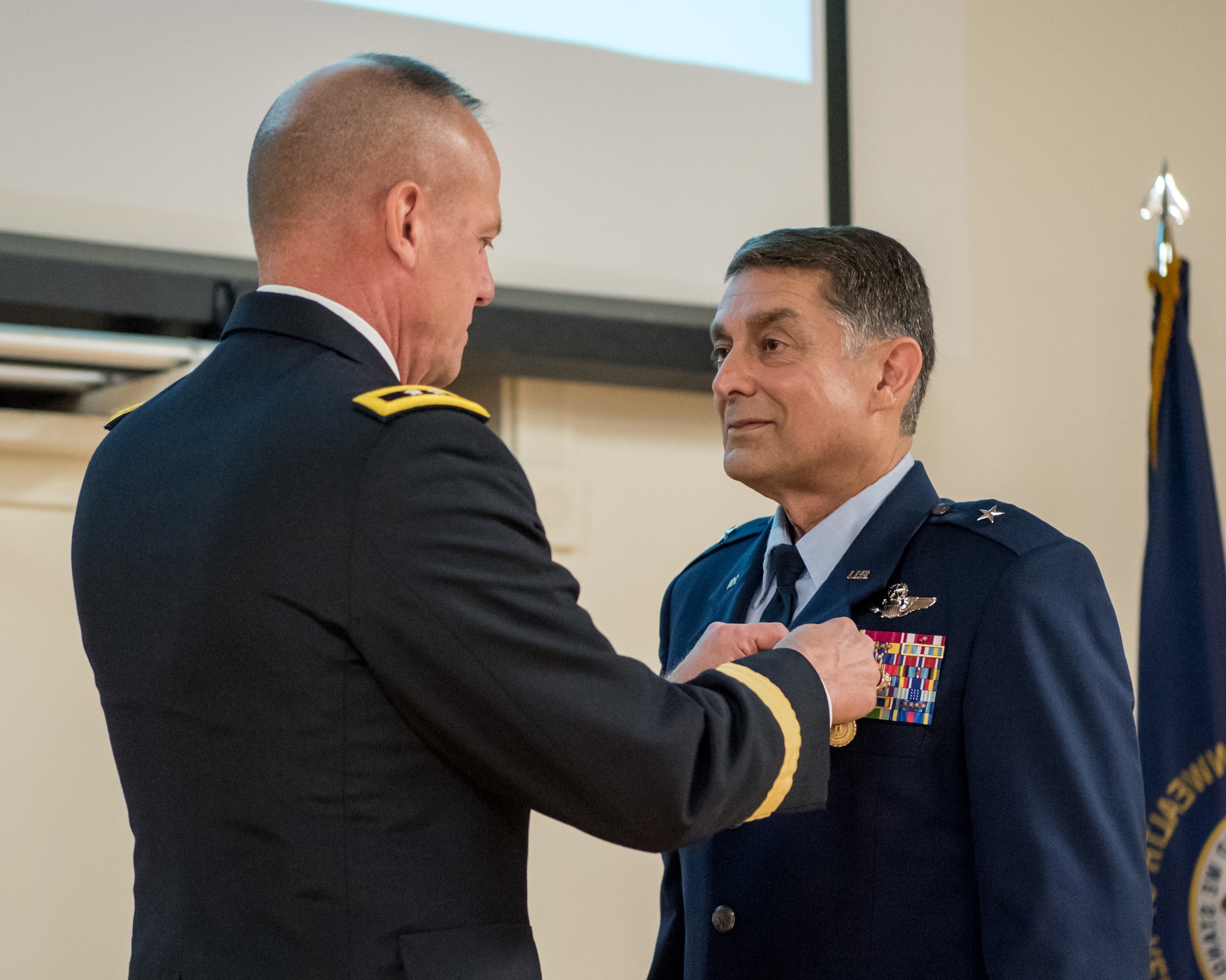 Brig. Gen. Warren Hurst (right), Kentucky’s outgoing assistant adjutant general for Air, is pinned with the Kentucky Distinguished Service Medal by Army Maj. Gen. Stephen Hogan, Kentucky’s adjutant general, during Hurst’s retirement ceremony at the Kentucky Air National Guard Base in Louisville, Ky., Nov. 16, 2019. Hurst is retiring after more than 34 years of service to the active-duty Air Force and Kentucky Air National Guard. (U.S. Air National Guard photo by Staff Sgt. Joshua Horton)