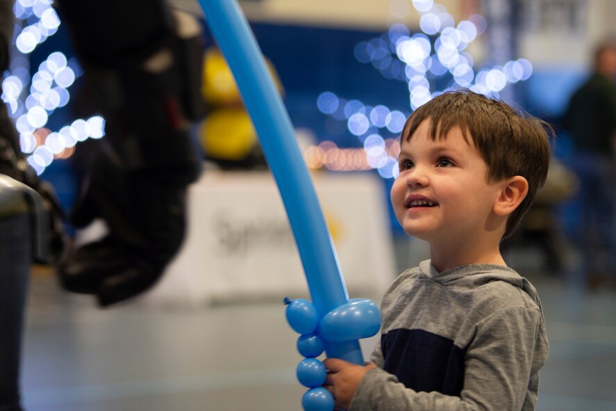 Lucas, 3, plays with a balloon sword at the annual Children’s Holiday Fest at Schriever Air Force Base, Colorado, Dec. 7, 2019. At the event, children received free balloon crafts, hot chocolate and cookies courtesy of the 50th Force Support Squadron. (U.S. Air Force photo by Airman 1st Class Jonathan Whitely)